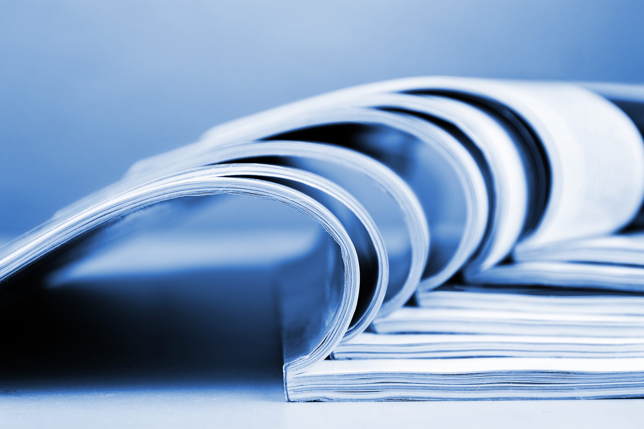Stack Of Newspapers Lying On The Table